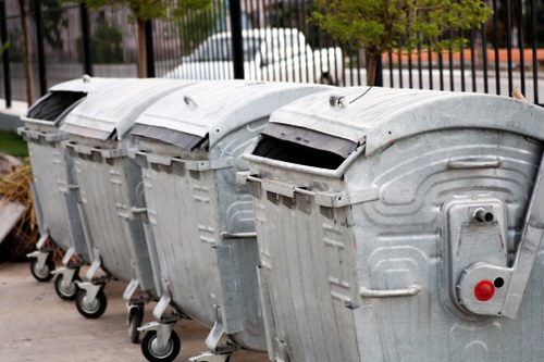Professional team members of Jims Rubbish handling waste